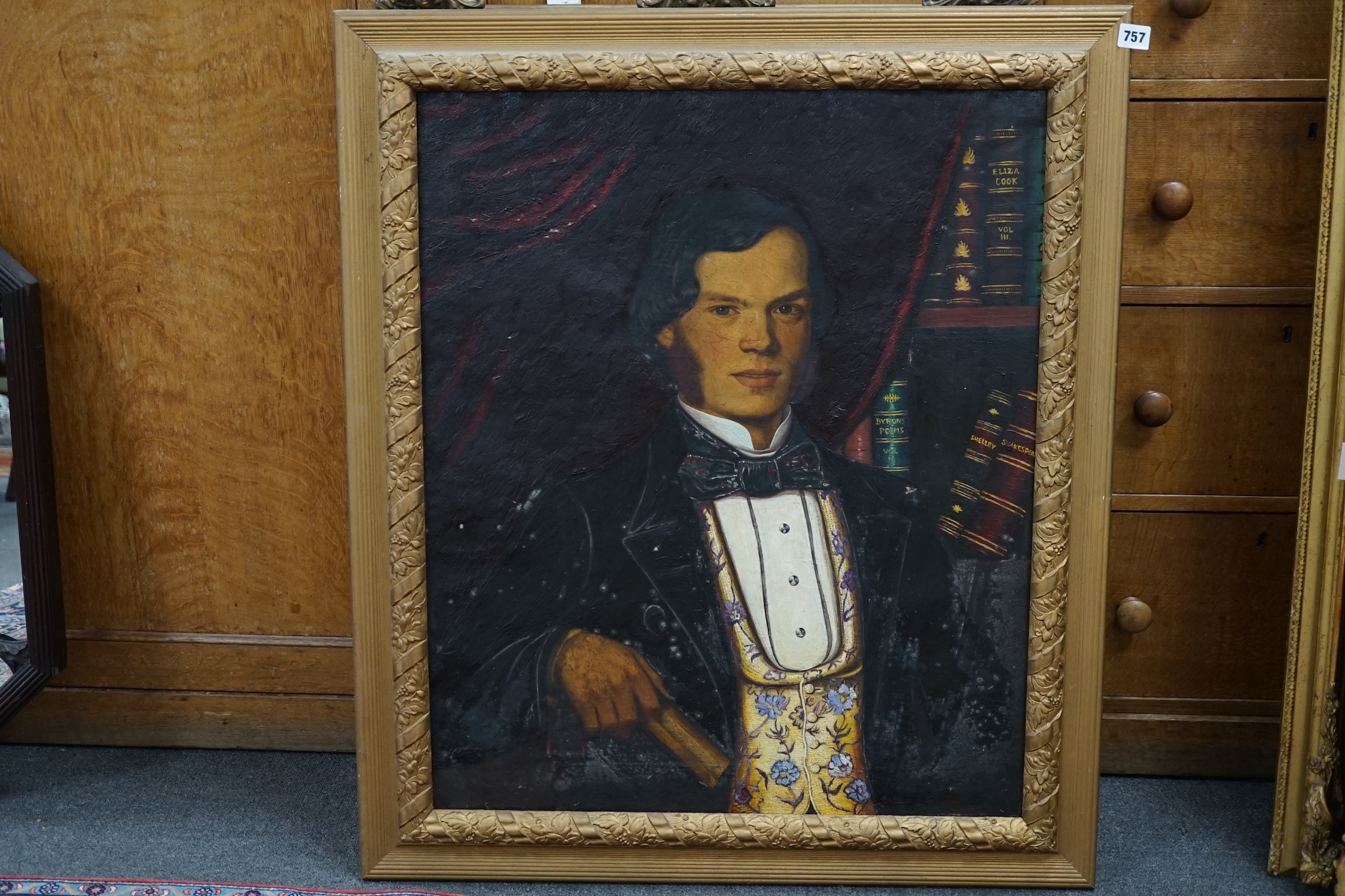 19th century, naive English School, oil on canvas, Portrait of a gentleman before various novels, including Eliza Cook, Byron's Poems and Shakespeare, 74 x 61cm. Condition - poor